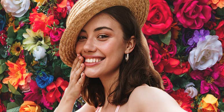 Birth Month Flower Meanings & Symbolism woman in front of flowers