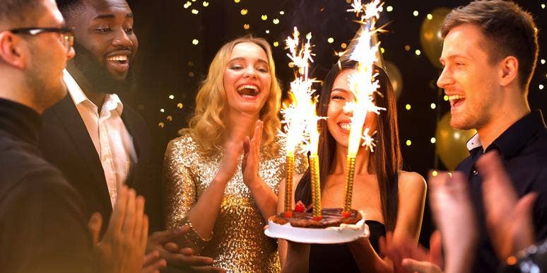 What Your Birth Month Says About Your Chance Of Serious Health Risks friends celebrating birthday with cake sparklers