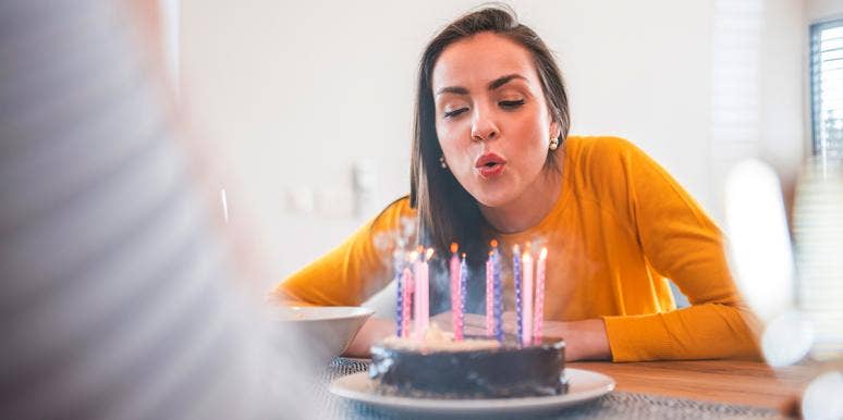 The Crazy Insights Your Birth Month Reveals About You And Your Life woman blowing out birthday candles