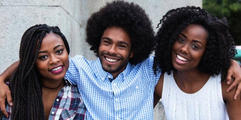 a group of black people smiling