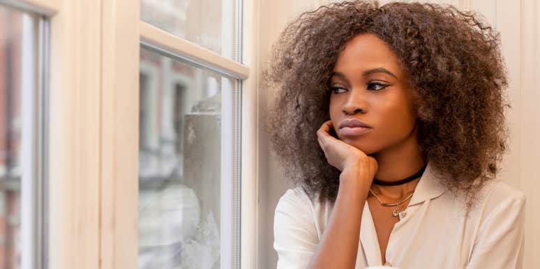 Woman's Tactic For Hiding Her Crush On Brother-In-Law From Husband Generates Backlash Online Woman looking out window