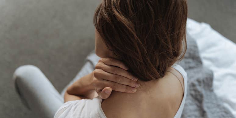 woman having neck pain