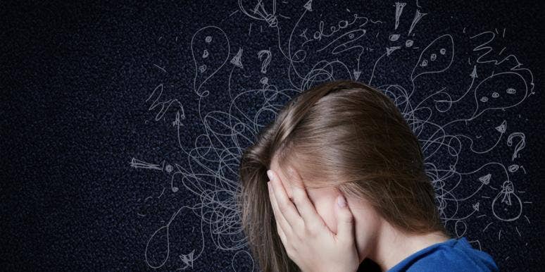 This Is Your Brain On Anxiety woman with head in hands