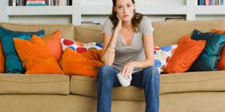 woman sad on the couch