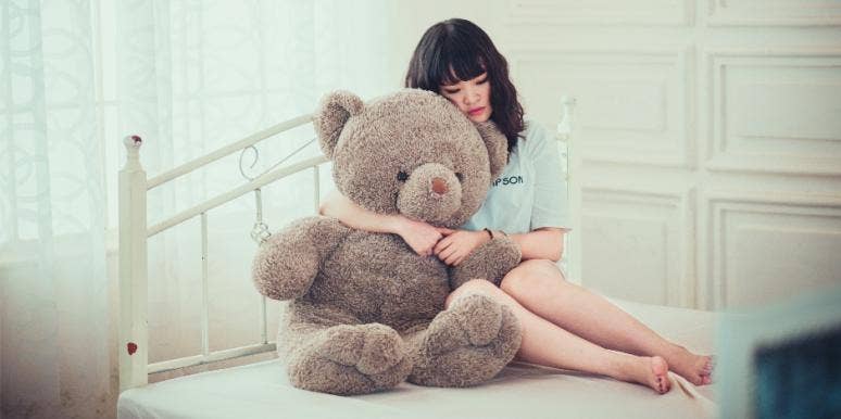 Girl hugging stuffed bear Girl hugging stuffed bear