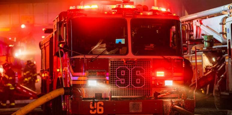 FDNY at Bronx Fire Shares How She Keeps Her Faith FDNY fire truck in the dark, red lights flaring, firefighters in the background