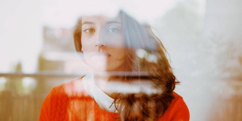 break free from burnout culture woman in red looking burned out and tired