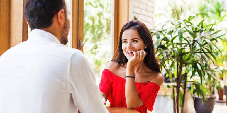 Can You Make Yourself Fall In Love? Relationship Experts Weigh In On If Love Is A Choice man and woman flirting