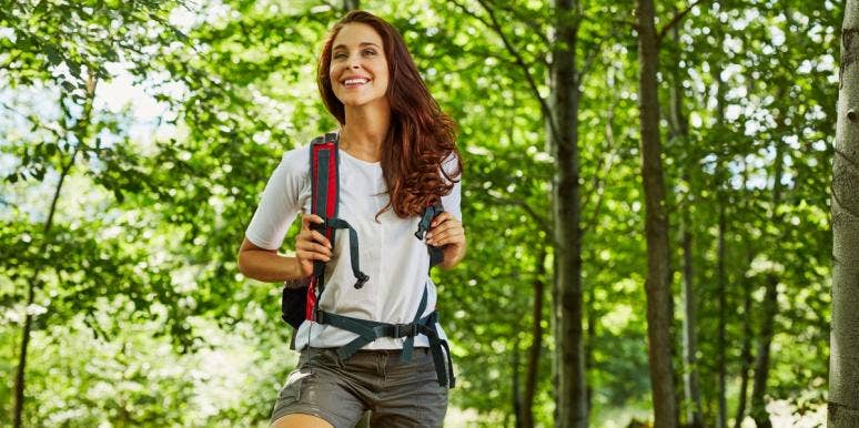 can you prevent dementia? older woman hiking in the forest