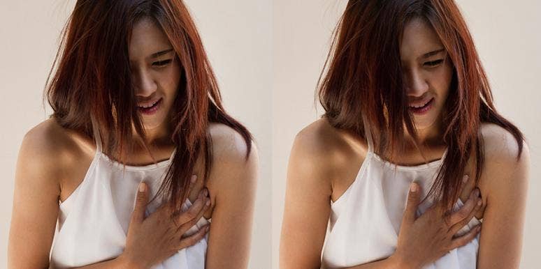 Odd Cancer Symptoms You Must Know After Teen With Leaking Breasts Discovers Brain Tumor woman clutching breast
