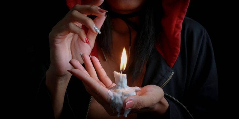 woman interpreting candle flame meanings