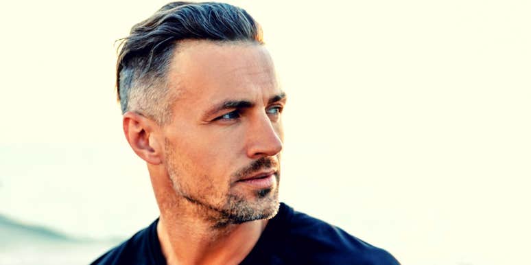 5 Things You Need To Do If Your Wife Cheated white man with greying hair looks to the side against light background