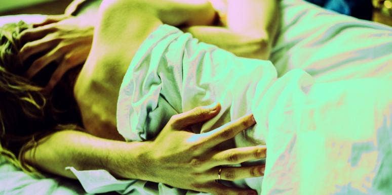 couple lying in bed because they can't walk after sex
