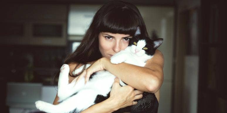 The Weird Way Your Cat Can Save Your Broken Relationship woman with cat