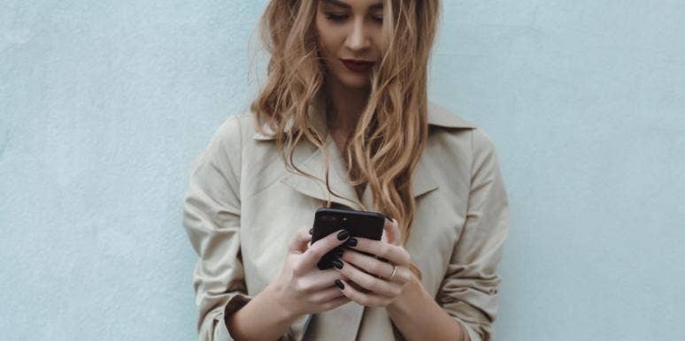 I Changed My Facebook Relationship Status And Sh*t Hit The Fan woman using phone