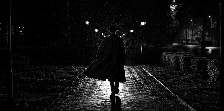 dark figure walking away