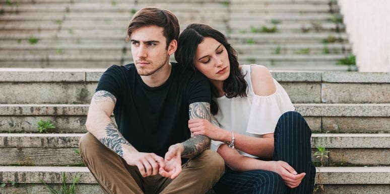 The Bizarre Factor That Makes Him Twice As Likely To Cheat On You man and woman on steps