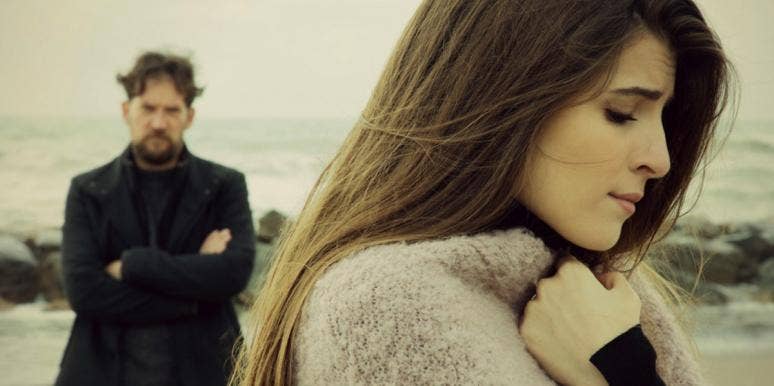 Is There Such A Thing As "Ethical" Cheating? This Website Says Yes distraught women with man in black behind her
