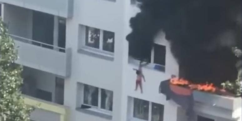 Crowd Catches Two Children Who Jumped From A Burning Building