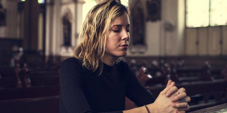 woman praying at church