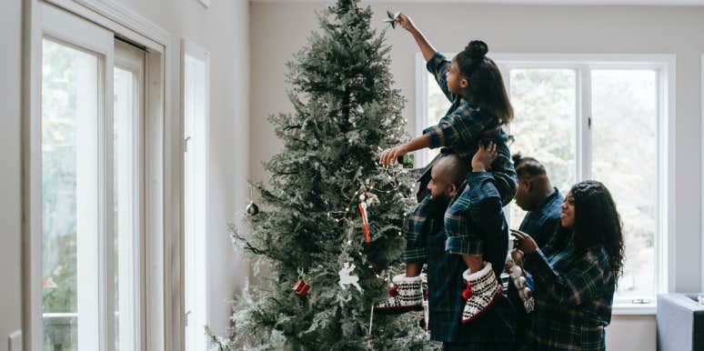 Dad Cancels Christmas To Save Money—& Buys Himself A PS5 Family decorating Christmas tree