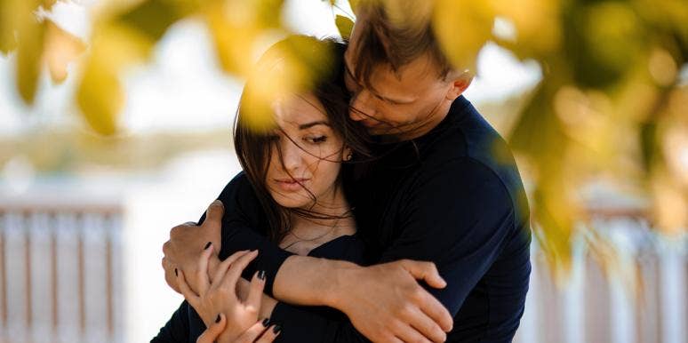 A Half Plus A Half Doesn't Equal A Whole: How Codependency Ruined Our Relationship couple hugging in fall leaves