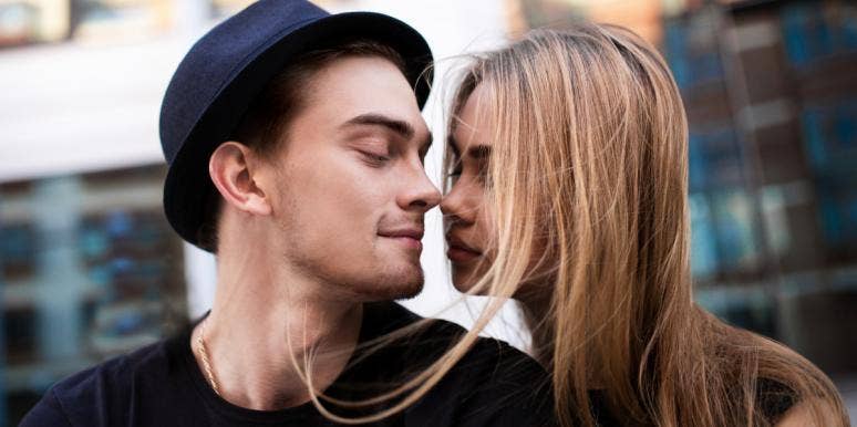 The Harsh Reality Of Continuing College Relationships After Graduation couple close to kissing man in top hat