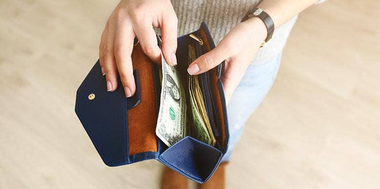 I'm Cheating On My Husband With Money (And I Bet You Are, Too) photo of woman opening wallet