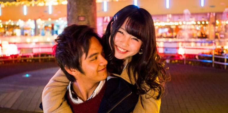 compromise in a relationship woman hugging man from the back
