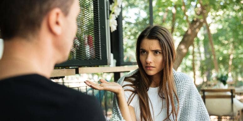 Woman Asks If She Was Wrong To Walk Out On Boyfriend Who Brought Bell To Restaurant To Grab Staff’s Attention confused woman gesturing with hand and looking at boyfriend