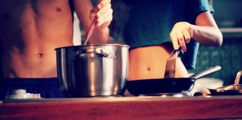 couple cooking food together couple cooking food together