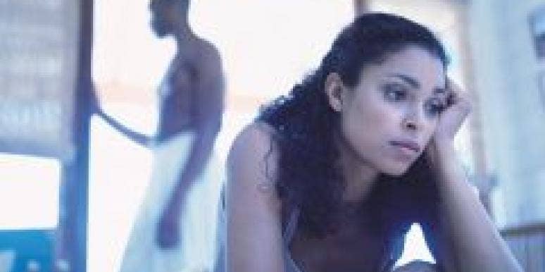 Could This DVD Help You Have Better Sex? upset woman in bed with man in background