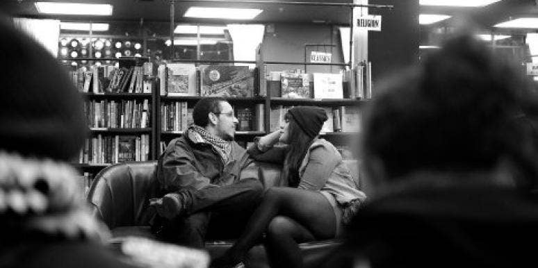 couple talking in the library couple talking in the library