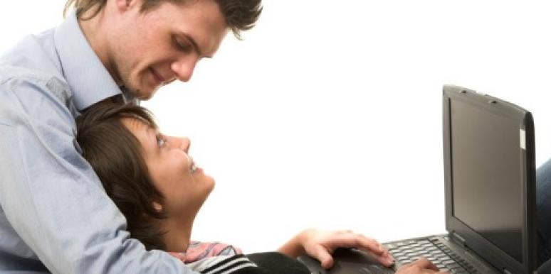 loving couple using computer Relationship Fail: I Hope It's OK I Just Proposed On Facebook