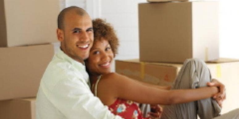 Is 3 Months Too Soon To Move In Together? Copule surrounded by boxes