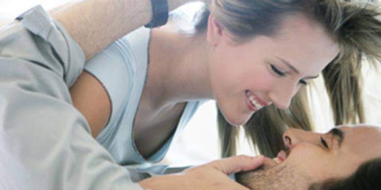 happy couple in bed with lube happy couple in bed with lube