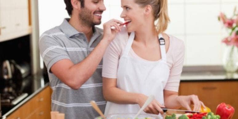 couple happy cooking