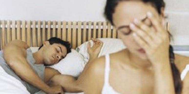 How To Handle Your One-Night Stand couple in bed man asleep woman with head in hand