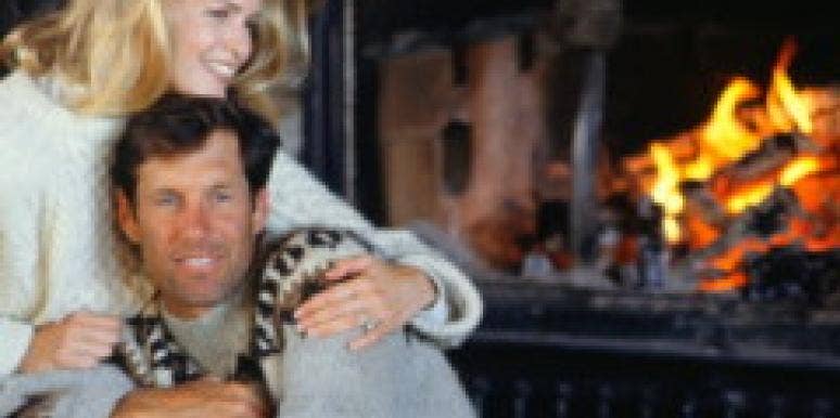The Best of YourTango: Warming Up In Cooler Months a couple relaxes by a fireplace
