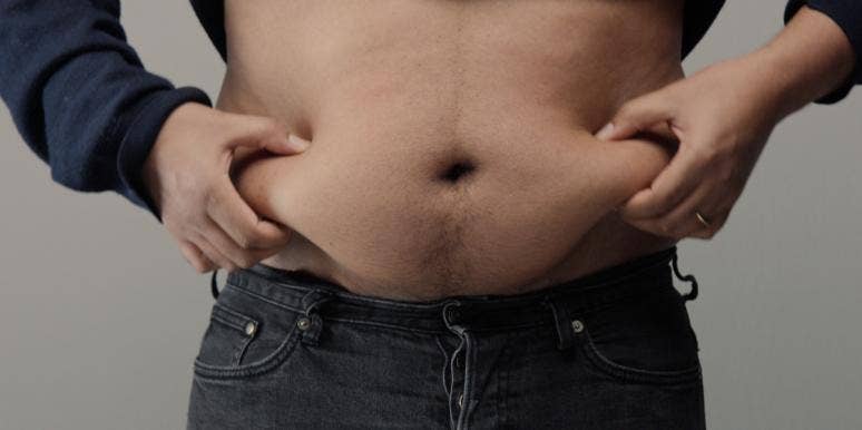 5 Reasons I'm 100 Percent Against The Dad Bod man holding belly fat