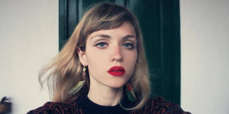 dark empaths solemn woman wearing red lipstick