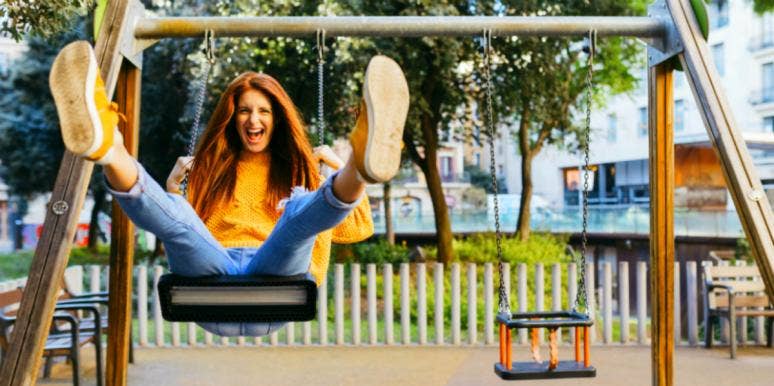 smiling woman on a swing