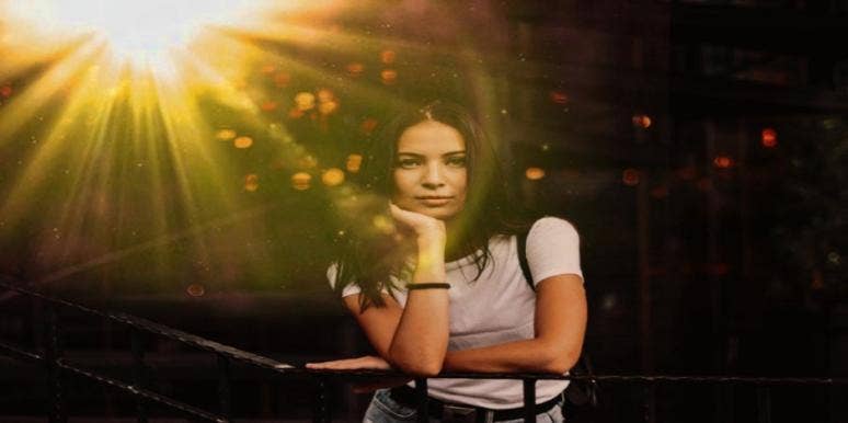 woman thinking about deceased loved one signs deceased loved one is still with you