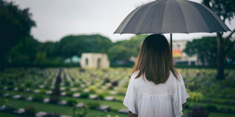 Dealing With Grief When You Don’t Know How To woman in a graveyard with an umbrella