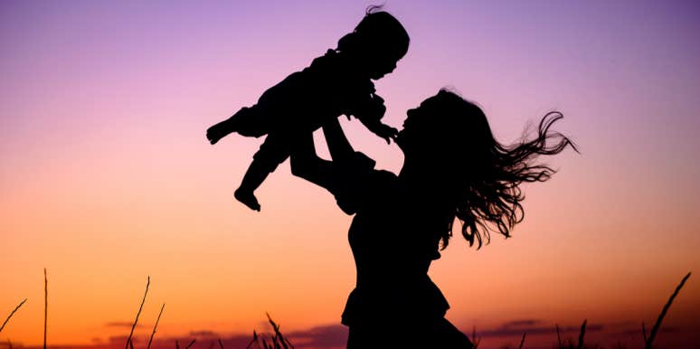 The Death Of My Alcoholic Father Made Me A Better Mom mom throwing baby in air