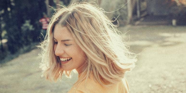 Why Defining Anxiety & Anxiety Disorders Matters woman laughing in field