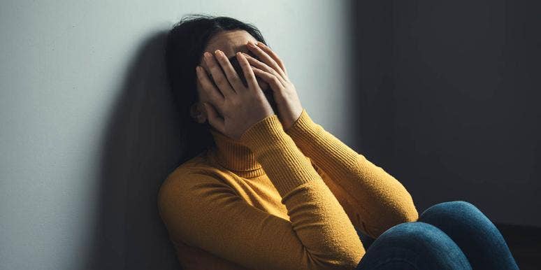 'Put On A Happy Face': How I Manage Severe Depression As A Mom woman with hand over eyes