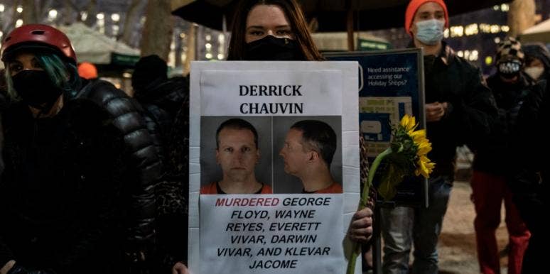 Will Derek Chauvin's Guilty Verdict Lead To Police Reform? protestor holding sign about convicted former police officer Derek Chauvin