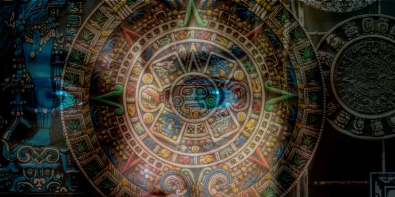 Did The World End In 2012? Doomsday Theory Explained & Debunked eyes peeking behind Maya calendar