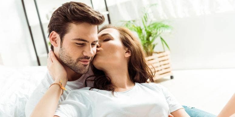 100 Dirty Things To Say To A Guy To Turn Him On woman kissing man's ear
